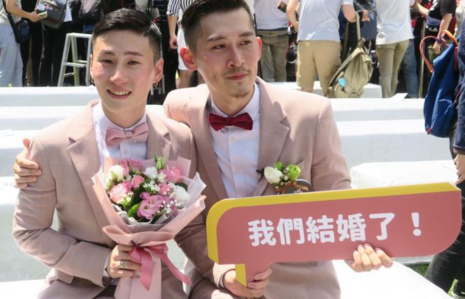 A gay couple celebrates Taiwan legalizing same-sex marriage in 2019. Photo: Courtesy Kyodo News
