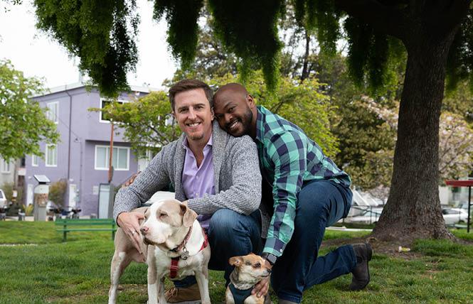 Trevor Chandler, left, a candidate for District 9 supervisor in San Francisco, visited a park with his fiancé, Adrian Chang, and their dogs, Juliet and Milos. Photo: Courtesy Trevor Chandler