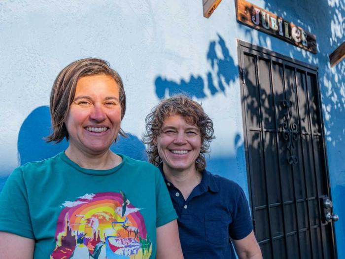 Rebecca Longworth, left, and Joan Howard stand in front of their East Oakland home, which used to be the site of The Jubilee, an old lesbian bar. Photo: Jane Philomen Cleland
