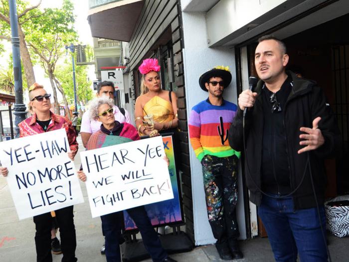 Queer LifeSpace Executive Director Ryan MacCarrigan, right, spoke to supporters May 18 about the threat of eviction to the LGBTQ therapy agency. Photo: Rick Gerharter